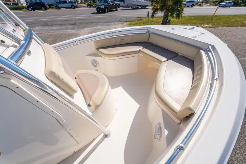 Slide: The Image of 2017 Cobia 220 Center Console boat interior with cushioned seating and stainless steel railings. - 15