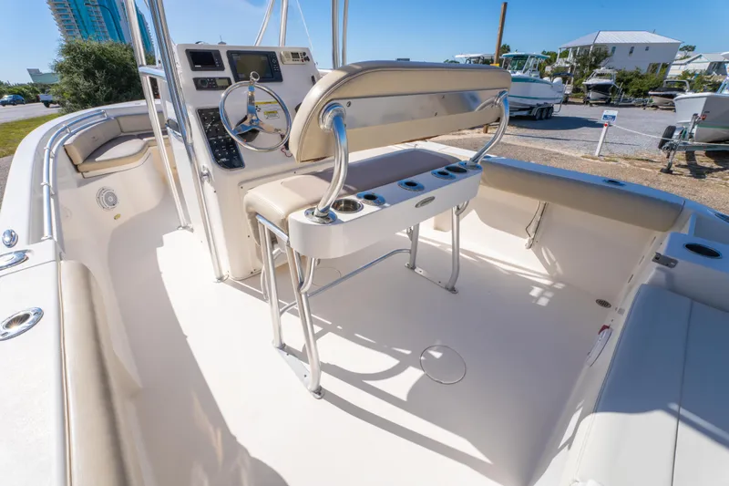Slide: The Image of 2017 Cobia 220 Center Console boat interior with steering wheel and seating. - 17