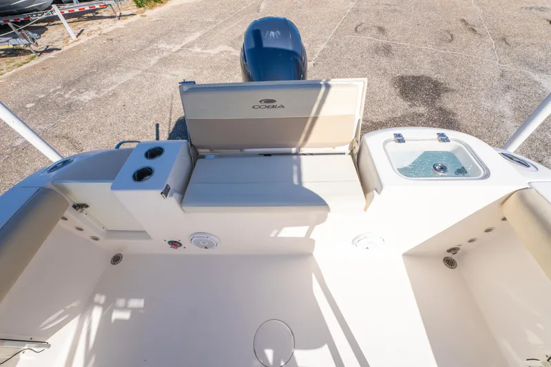 Slide: The Image of 2017 Cobia 220 Center Console boat interior with seating and storage compartments. - 19