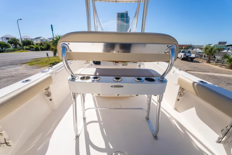 Slide: The Image of 2017 Cobia 220 Center Console boat interior with seating and rod holders. - 21