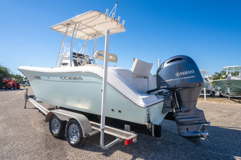 Slide: The Image of 2017 Cobia 220 Center Console boat with Yamaha engine on trailer. - 8