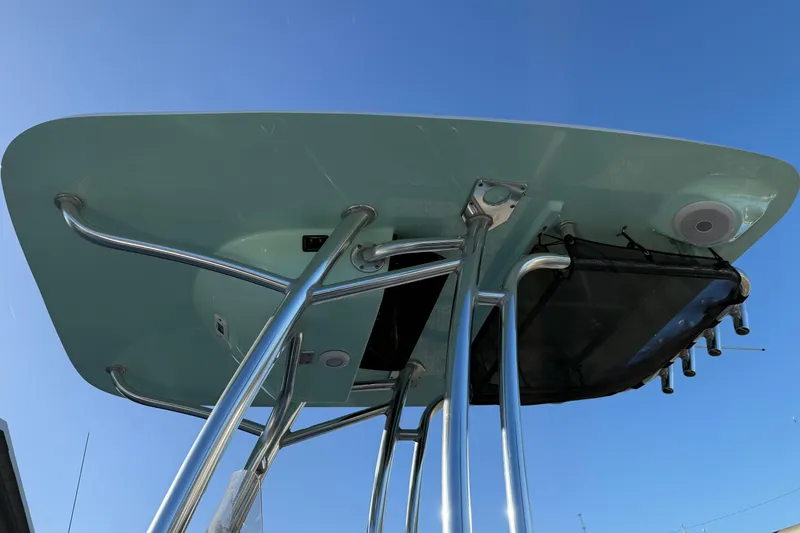 Slide: The Image of 2022 Key West 203 FS boat T-top against clear blue sky. - 10