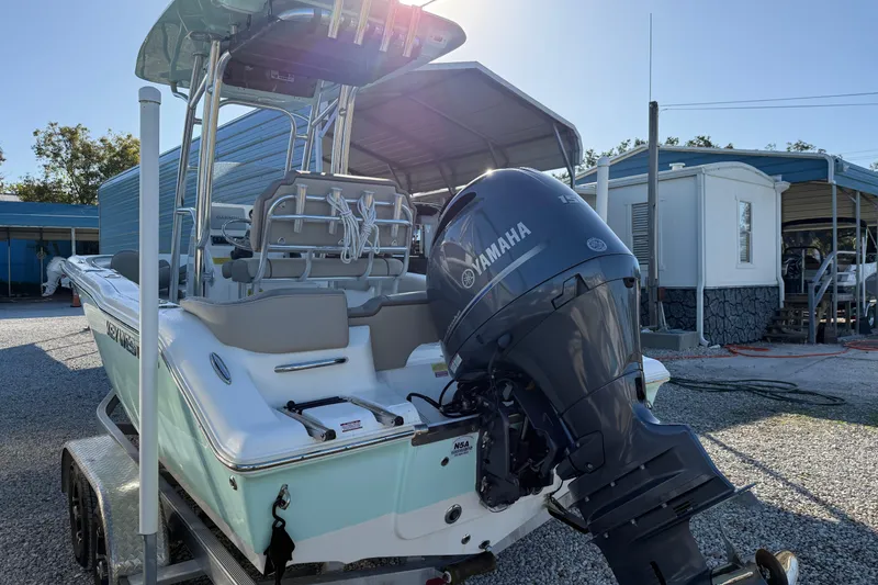 Slide: The Image of 2022 Key West 203 FS boat with Yamaha engine on trailer in sunny outdoor setting. - 12