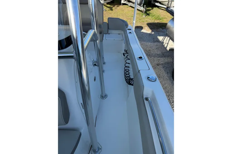 Slide: The Image of 2022 Key West 203 FS boat interior with stainless steel railings and seating. - 15