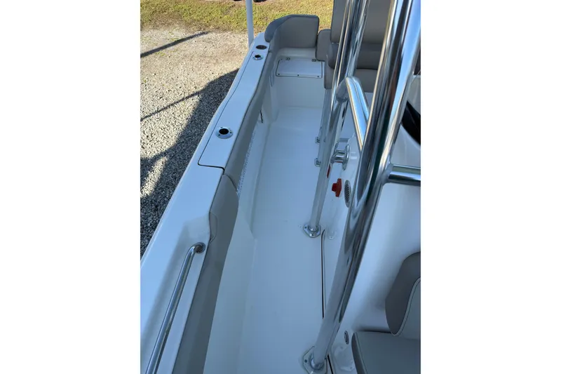 Slide: The Image of 2022 Key West 203 FS boat interior with stainless steel railings and seating. - 18