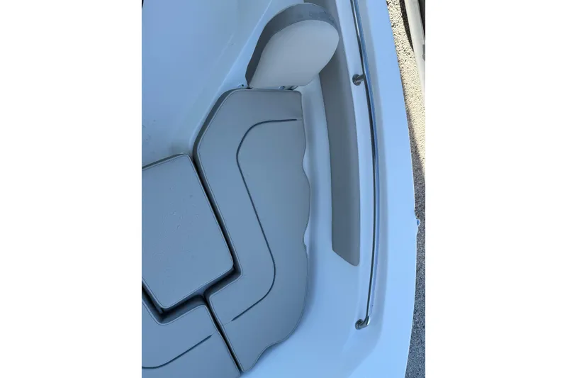 Slide: The Image of 2022 Key West 203 FS boat interior seating with gray cushions and sleek design. - 5