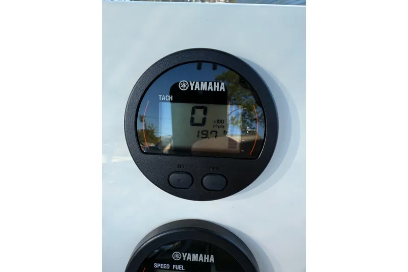 Slide: The Image of Yamaha tachometer on 2022 Key West 203 FS boat dashboard, displaying zero RPM. - 9