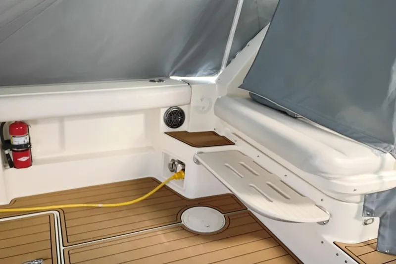 Slide: The Image of 1997 Tiara 3700 Open boat interior with teak flooring and safety equipment. - 10