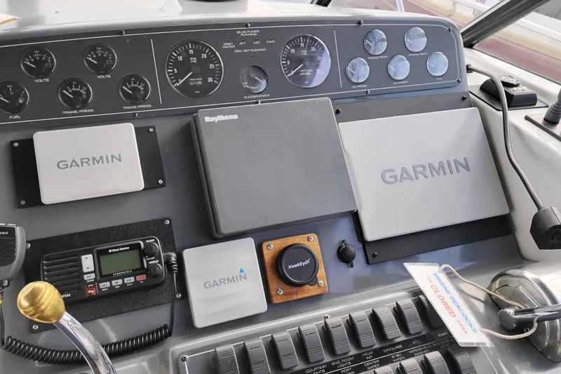 Slide: The Image of 1997 Tiara 3700 Open dashboard with Garmin and Raytheon navigation equipment. - 20