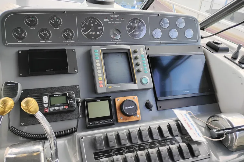 Slide: The Image of Control panel of a 1997 Tiara 3700 Open boat with navigation instruments. - 22