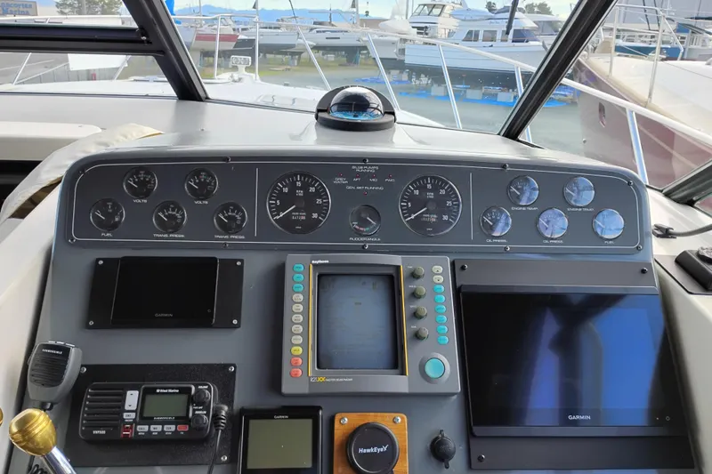 Slide: The Image of Control panel of a 1997 Tiara 3700 Open boat with navigation instruments. - 23