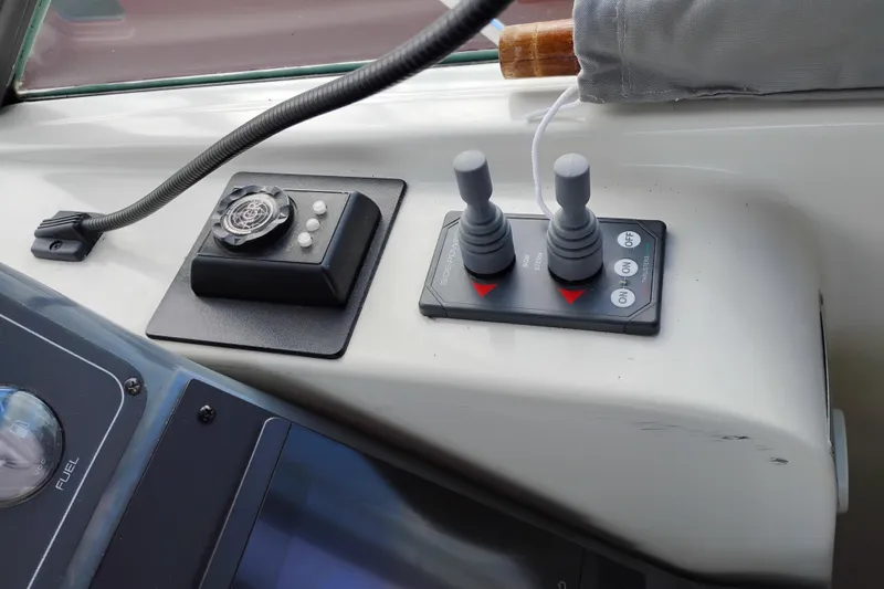 Slide: The Image of Control panel of a 1997 Tiara 3700 Open boat with joystick and buttons. - 26