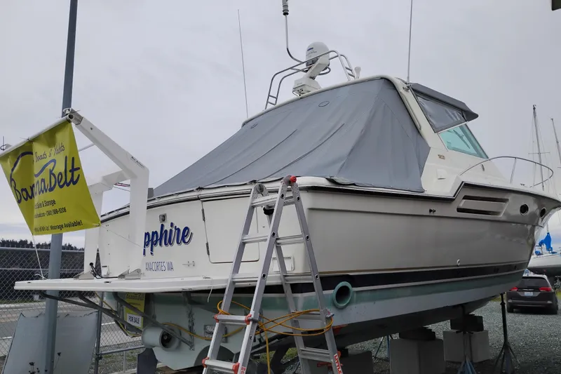 Slide: The Image of 1997 Tiara 3700 Open boat on display with cover and ladder. - 3