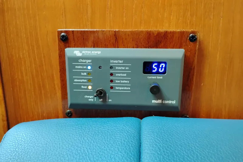 Slide: The Image of Control panel on 1997 Tiara 3700 Open boat, displaying Victron Energy charger settings. - 34