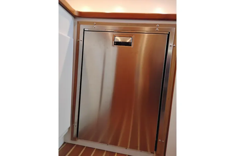 Slide: The Image of Stainless steel refrigerator on 1997 Tiara 3700 Open yacht interior. - 38