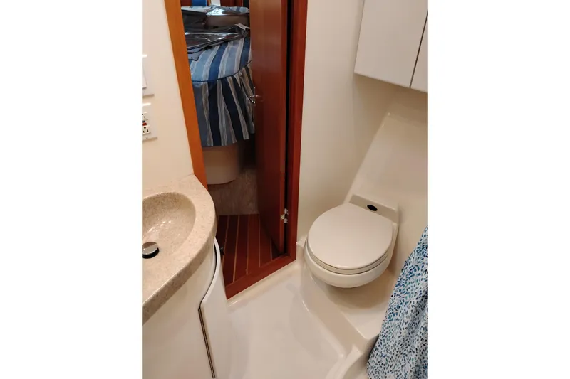 Slide: The Image of Bathroom interior of 1997 Tiara 3700 Open yacht with toilet and sink. - 48