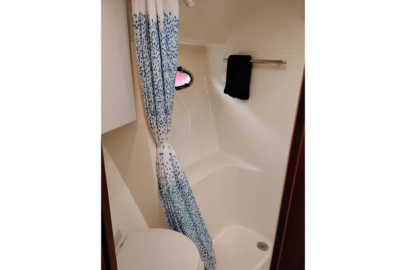Slide: The Image of Bathroom interior of 1997 Tiara 3700 Open yacht with shower and curtain. - 51