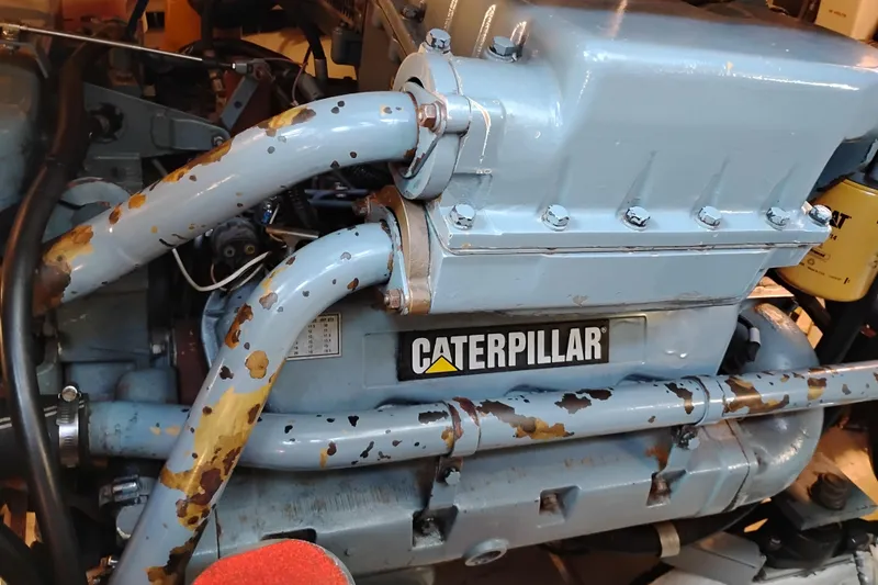 Slide: The Image of Engine of a 1997 Tiara 3700 Open boat with Caterpillar branding. - 53