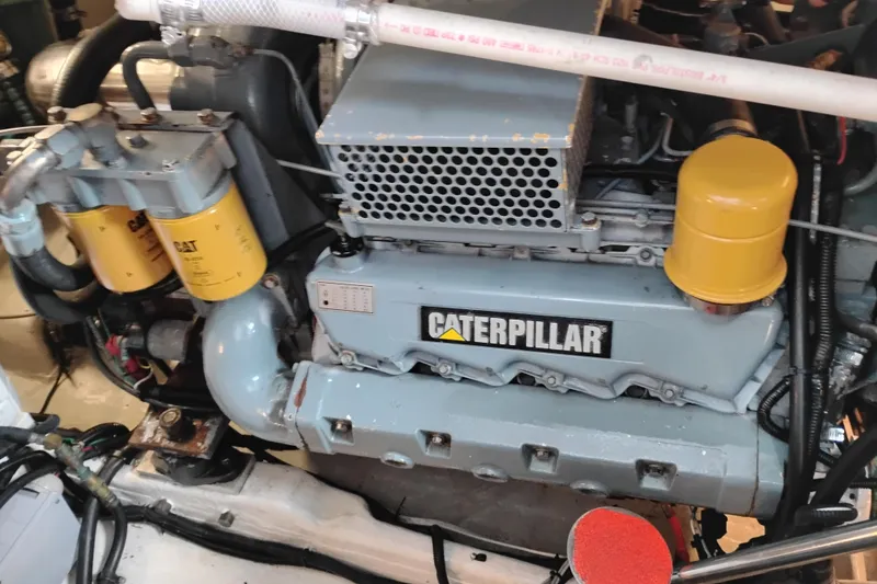 Slide: The Image of Engine of a 1997 Tiara 3700 Open boat with Caterpillar components. - 54
