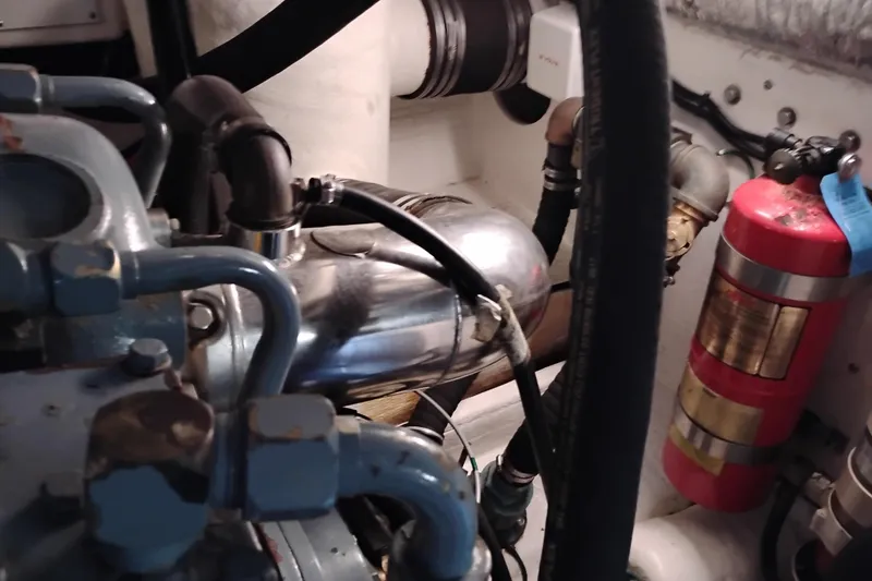 Slide: The Image of Engine compartment of a 1997 Tiara 3700 Open boat with visible fire extinguisher. - 59