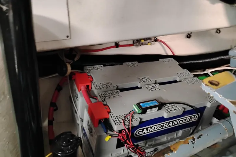 Slide: The Image of Battery setup in a 1997 Tiara 3700 Open boat, featuring Gamechanger 3.0 batteries. - 60