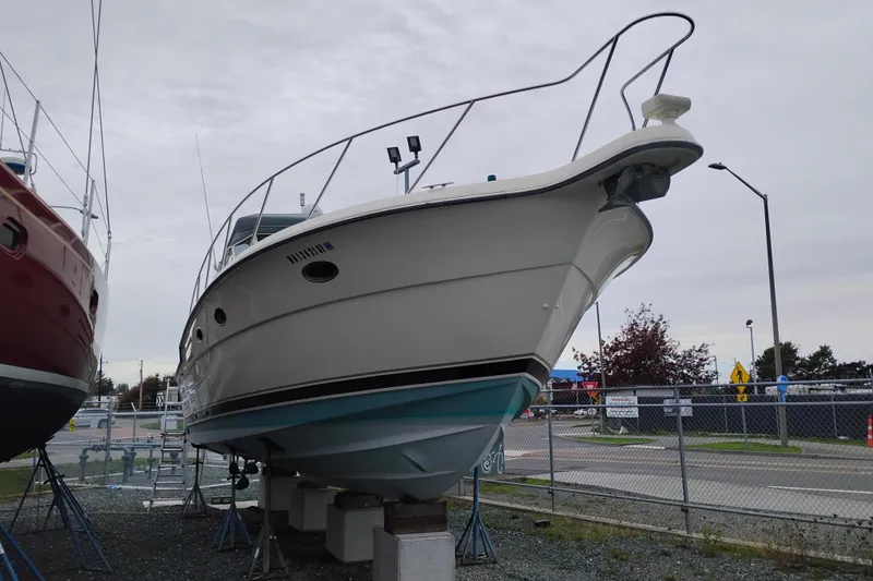 Slide: The Image of 1997 Tiara 3700 Open yacht on dry dock, side view, overcast sky. - 66