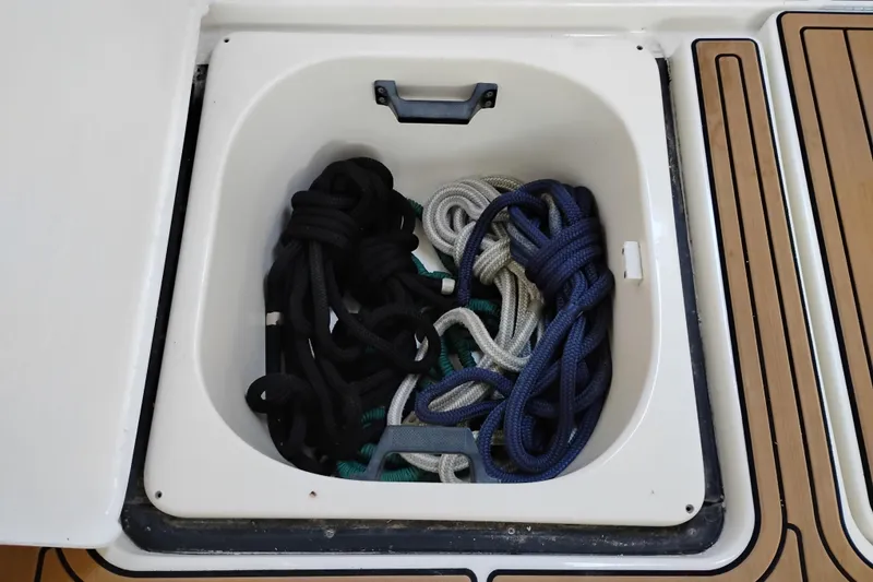 Slide: The Image of Storage compartment with ropes on a 1997 Tiara 3700 Open boat. - 7