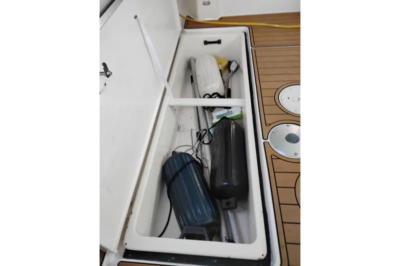 Slide: The Image of Storage compartment on 1997 Tiara 3700 Open boat, containing fenders and equipment. - 8