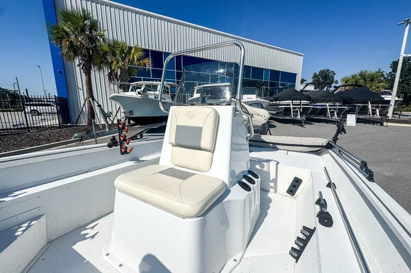 Slide: The Image of 2023 G3 Bay 17 boat with center console, displayed outdoors at a dealership. - 5