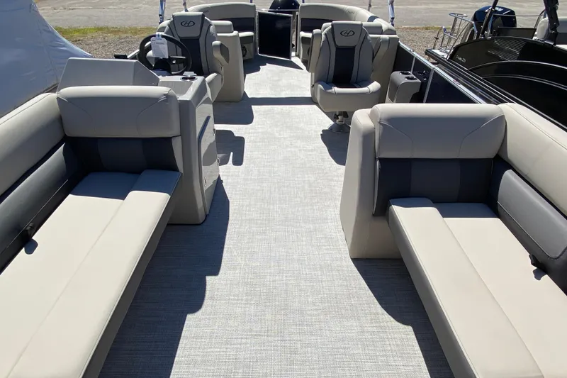 Slide: The Image of 2023 Harris Cruiser 250 pontoon boat interior with spacious seating and modern design. - 9