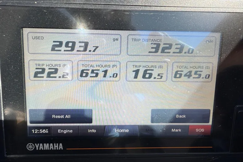 Slide: The Image of Display screen of 2020 Pursuit OS 325 Offshore showing trip and engine data. - 15