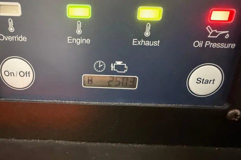 Slide: The Image of Control panel of a 2020 Pursuit OS 325 Offshore boat, displaying engine and oil pressure indicators. - 16