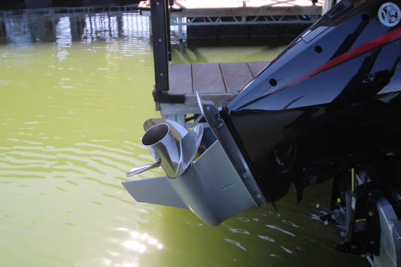 Slide: The Image of Close-up of a 2005 Bennington 2275FSi boat motor and propeller near dock. - 19