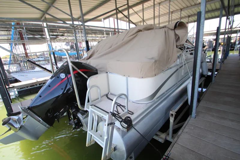 Slide: The Image of Covered 2005 Bennington 2275FSi pontoon boat docked in a marina. - 6