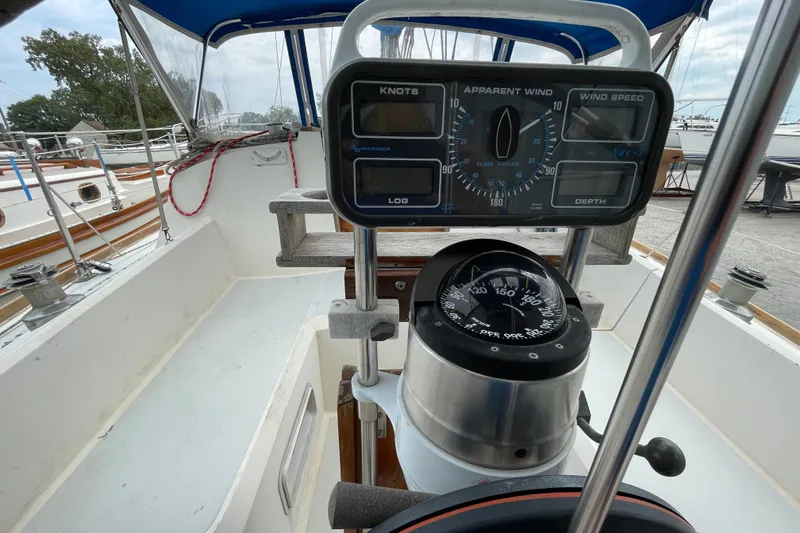 Slide: The Image of Cockpit of 1988 CAL 28 sailboat with navigation instruments and compass. - 12
