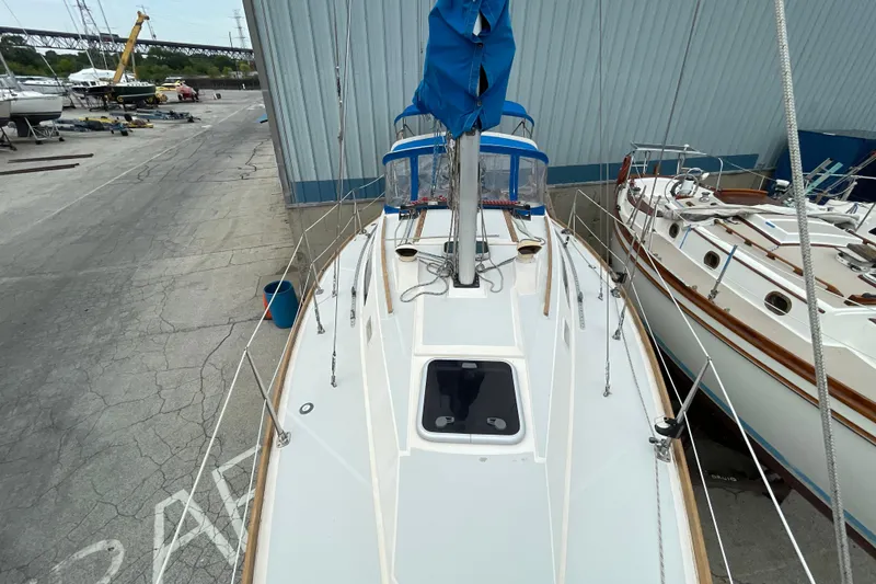 Slide: The Image of 1988 CAL 28 sailboat docked in a marina, view from above. - 18