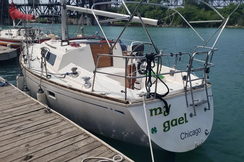 Slide: The Image of Sailboat docked at marina, CAL 28 model, 1988, named "my gael," located in Chicago. - 2