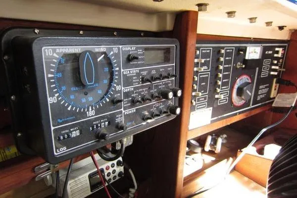 Slide: The Image of Control panel of a 1988 CAL 28 sailboat, featuring navigation and wind instruments. - 29