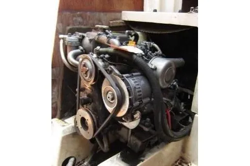 Slide: The Image of 1988 CAL 28 engine, detailed view of mechanical components and belts. - 39