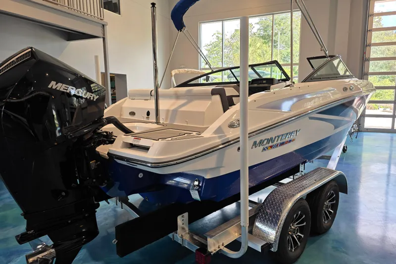 Slide: The Image of 2024 Monterey M-205 boat with Mercury engine on trailer in showroom. - 3