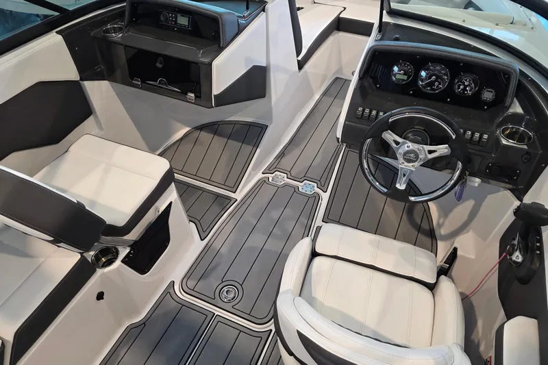 Slide: The Image of 2024 Monterey M-205 boat interior with modern dashboard and seating. - 7