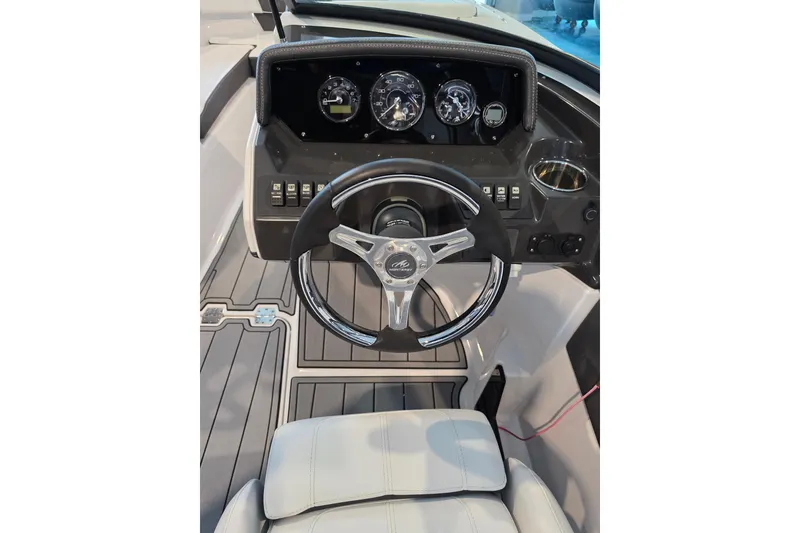 Slide: The Image of 2024 Monterey M-205 boat dashboard with steering wheel and instrument panel. - 8
