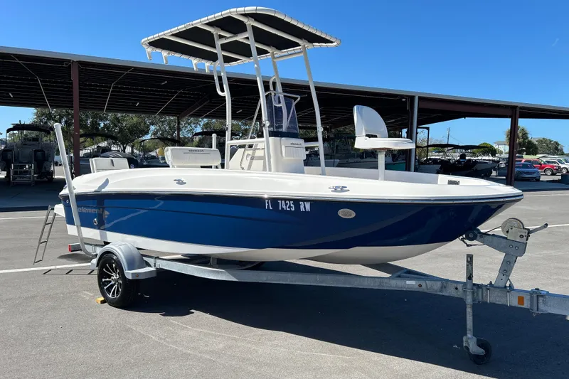 Slide: The Image of 2019 Bayliner Element F18 boat on trailer in parking lot. - 1