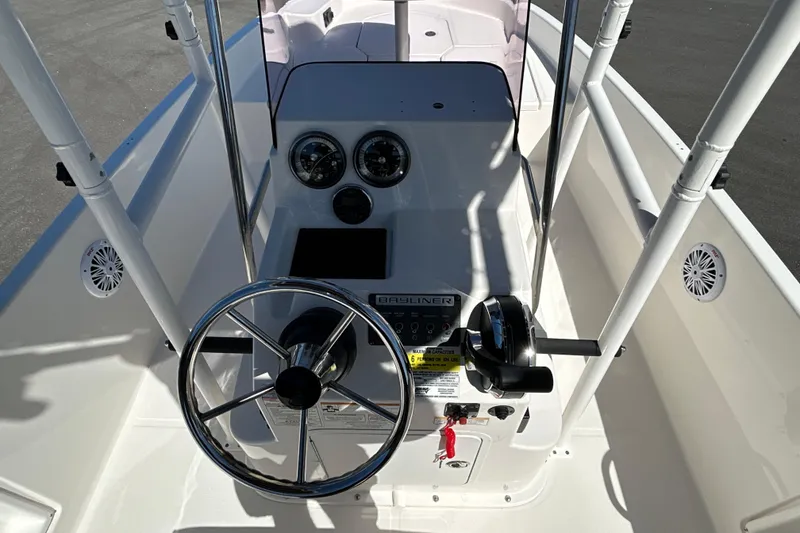 Slide: The Image of 2019 Bayliner Element F18 boat console with steering wheel and controls. - 11