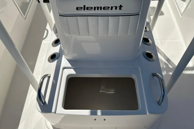 Slide: The Image of 2019 Bayliner Element F18 boat console with storage compartment and rod holders. - 15