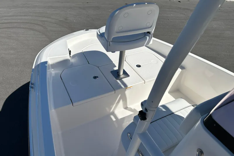 Slide: The Image of 2019 Bayliner Element F18 boat interior with seating and storage compartments. - 8