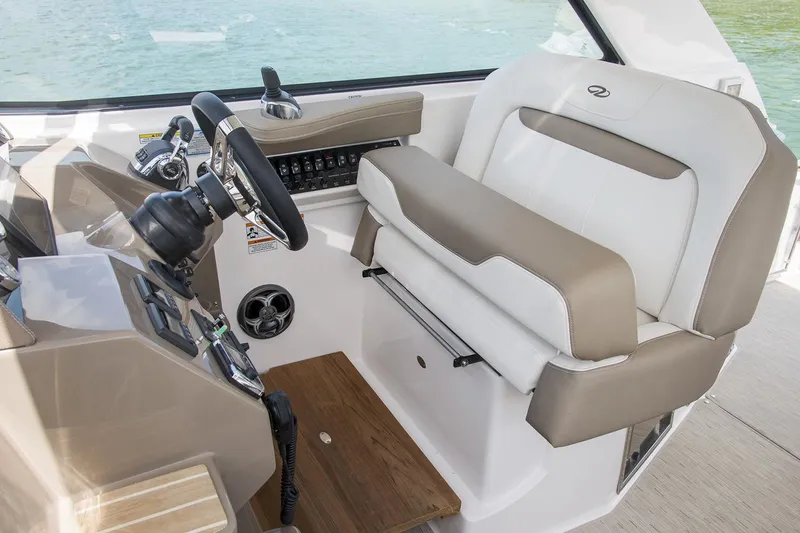 Slide: The Image of Manufacturer Provided Image: 2017 Regal 35 Sport Coupe helm station with leather seating and modern controls. - 5