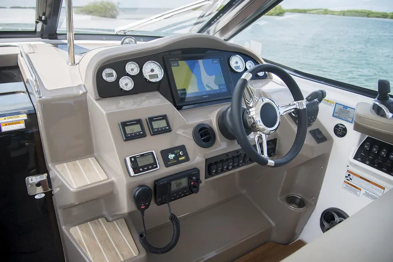 Slide: The Image of Manufacturer Provided Image: 2017 Regal 35 Sport Coupe boat dashboard with navigation system and controls. - 6