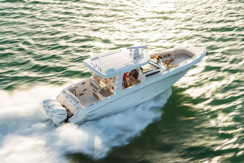 Slide: The Image of 2019 Boston Whaler 350 Realm boat in storage, blue hull, registration OH 9910 FX. - 1