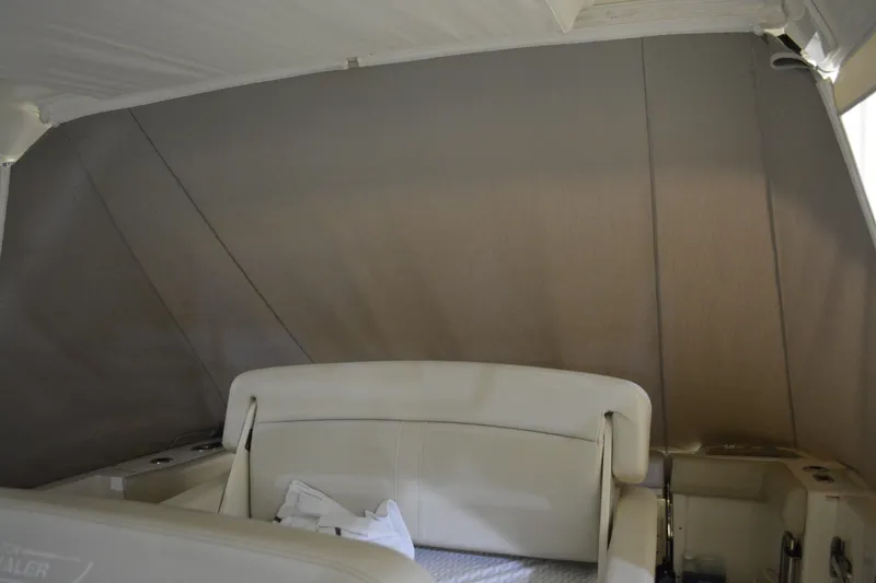 Slide: The Image of 2019 Boston Whaler 350 Realm boat covered in storage, featuring Raymarine equipment. - 20